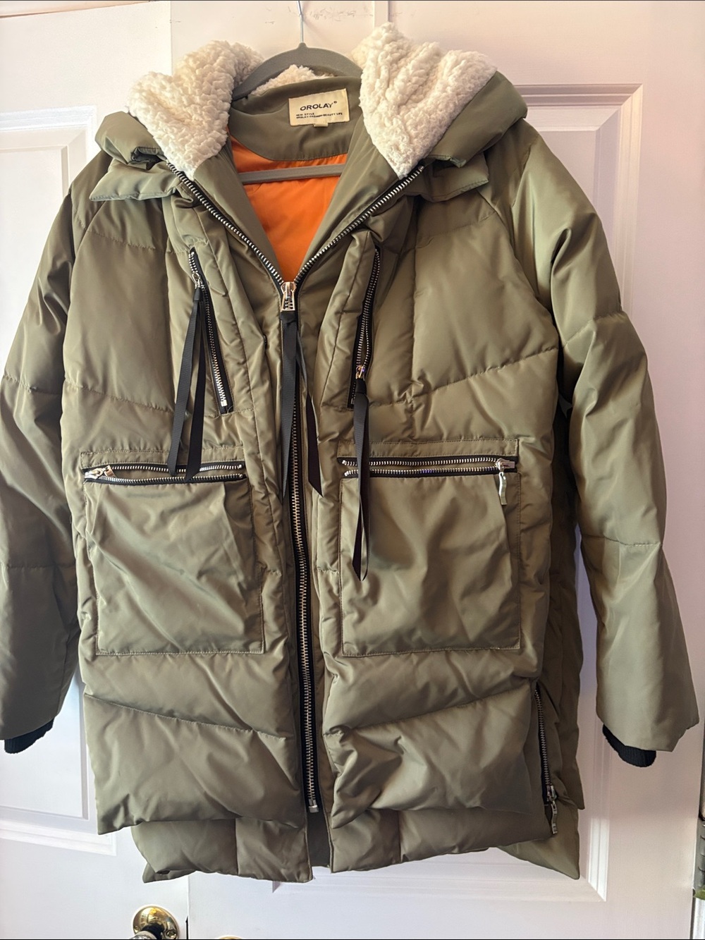 Orolay Olive Green Women’s Puffer Jacket with Orange Lining and fur lined hood.